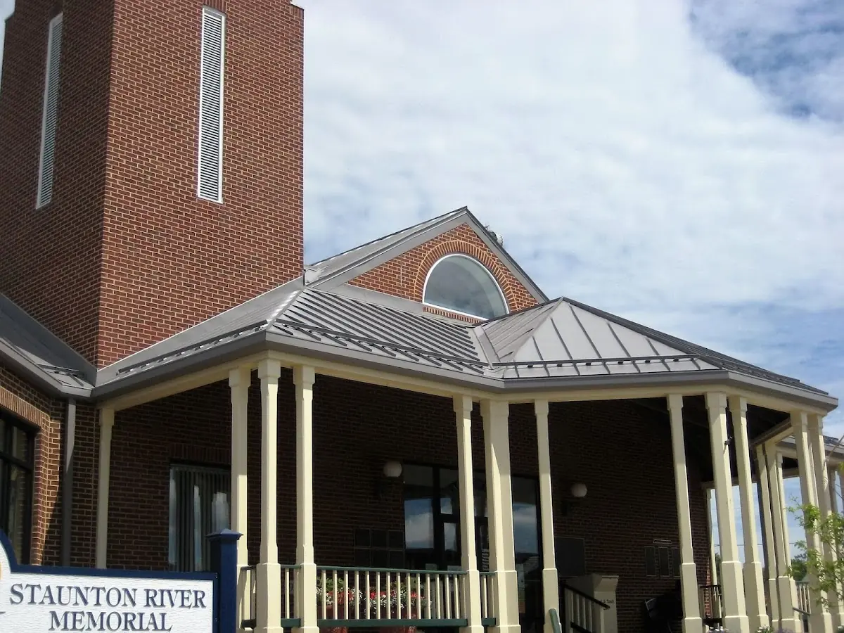 Skilled roofing craftsmen working on a residential roof in Springville